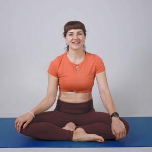 Pilates students performing stretches