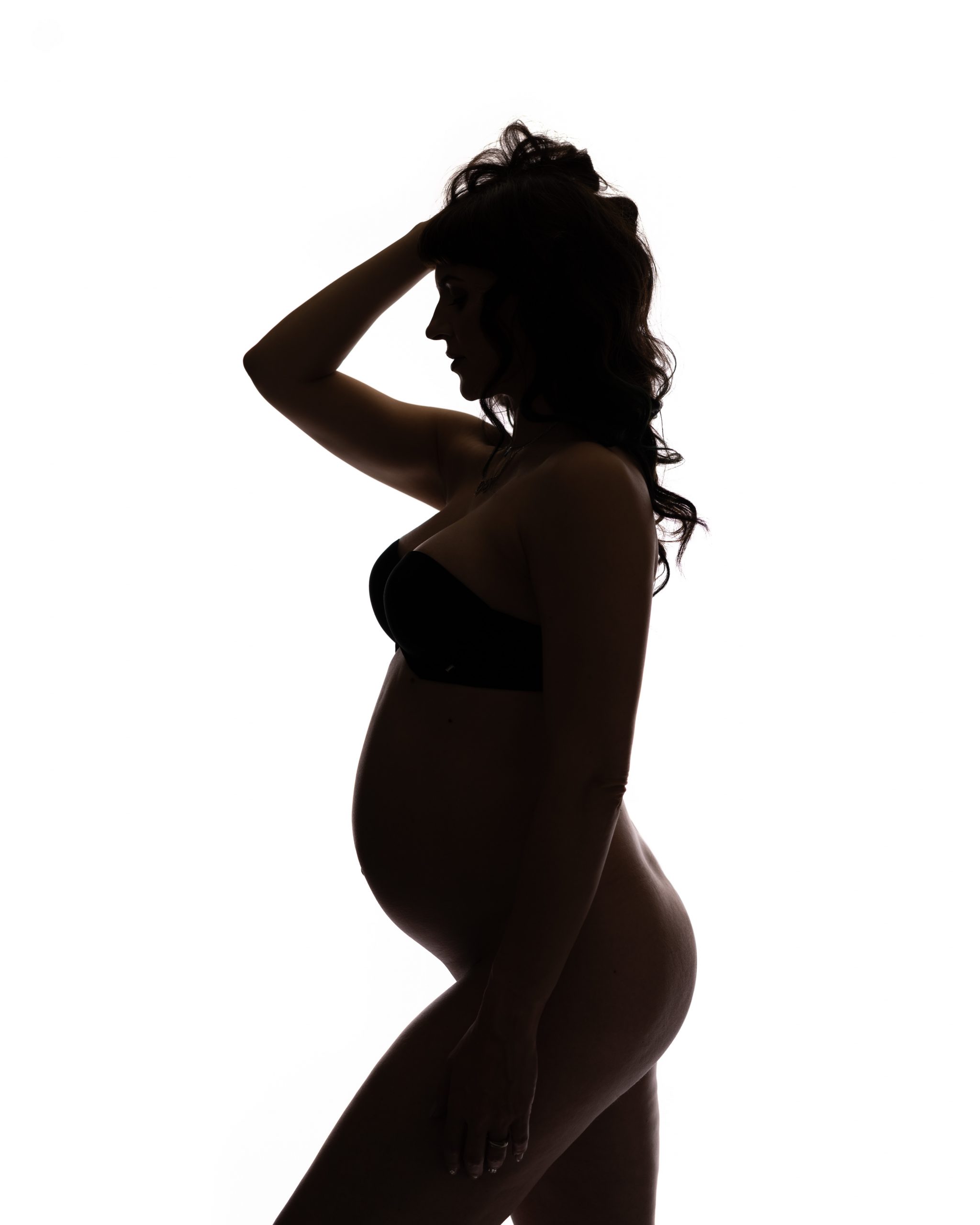 Pregnant woman practicing prenatal pilates